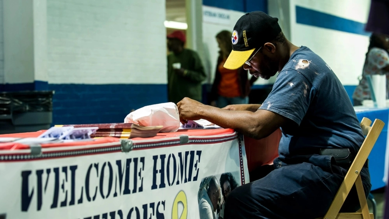 Dowling Charlton applies for health benefits and grants for homeless veterans during the Department of Veterans Affairs Annual Stand Down Against Homelessness Oct. 19, 2012, at the North Charleston Armory.