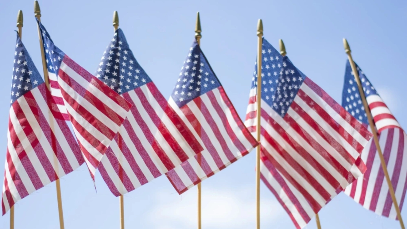 American flags representing the difference between memorial day vs veterans day vs labor day.