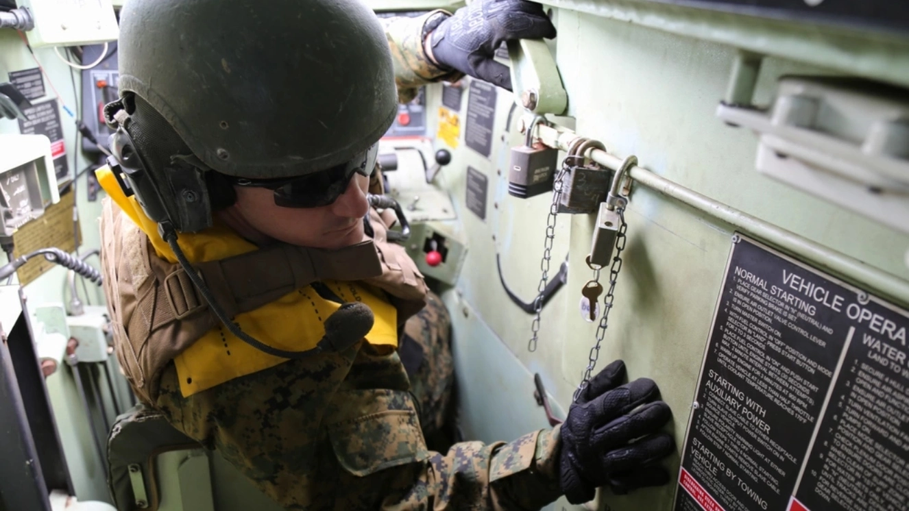 Soldier standing on an amphibious assault ship.