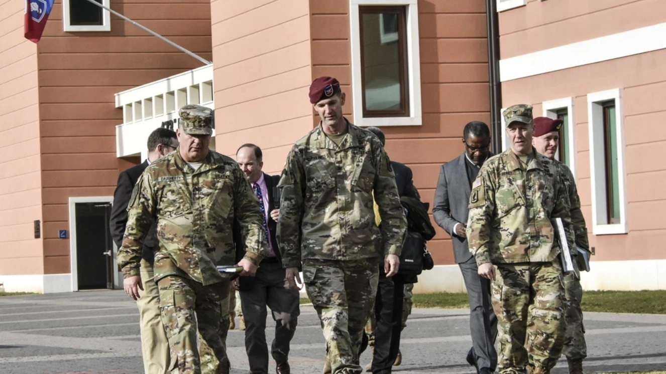 Brig. Gen. Timothy Daugherty, the US Army Europe G3 is briefed by Col. Jay Bartholomees, Commander of the 173rd Airborne Brigade and Col. Erik Berdy, USAG Italy Garrison Commander as they walk across Caserma Del Din, an Army base in Italy.