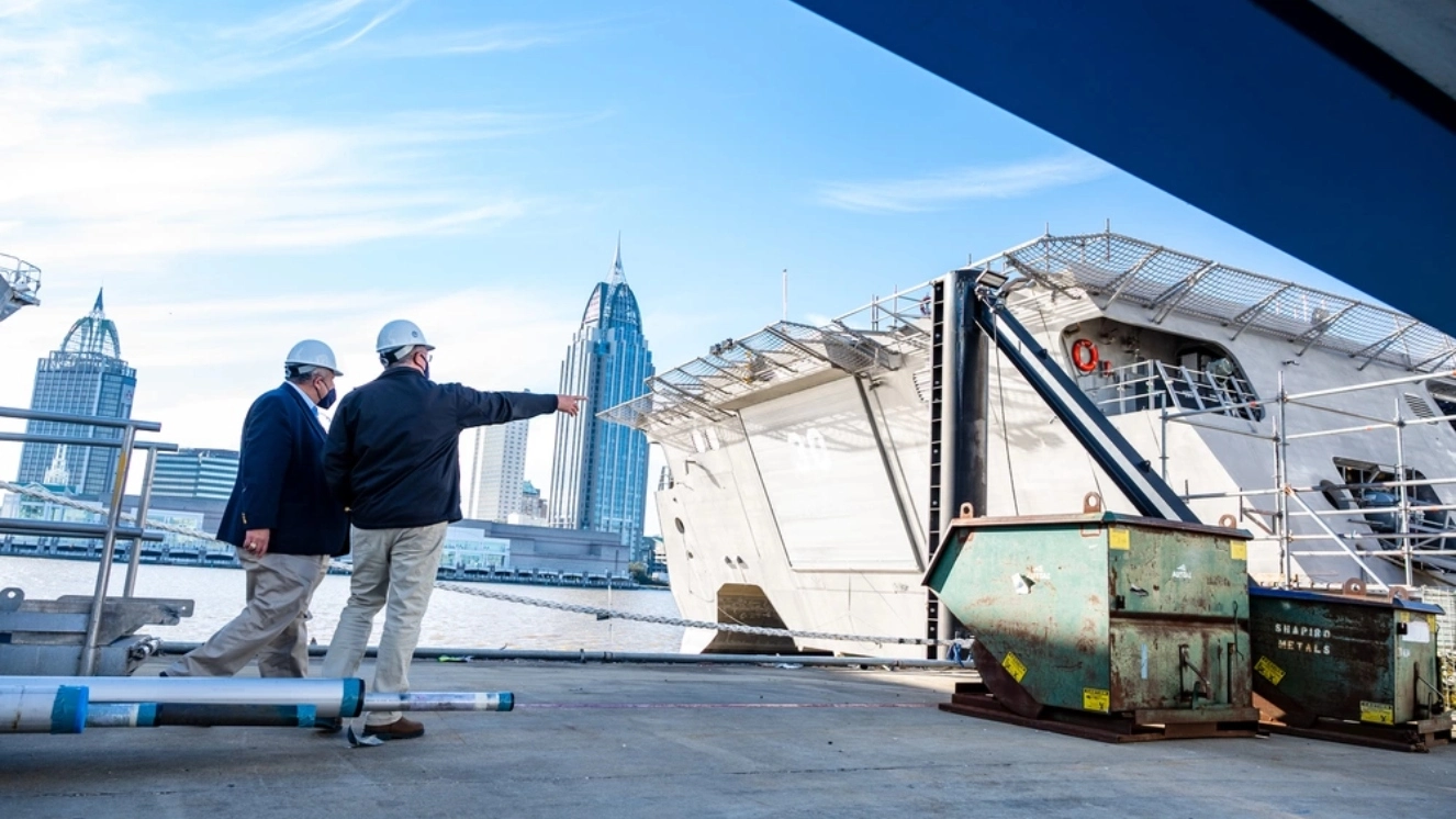 Secretary of the Navy Carlos Del Toro is shown various ship platforms in their final stages of production and upgrades during a shipyard tour of Austal USA.