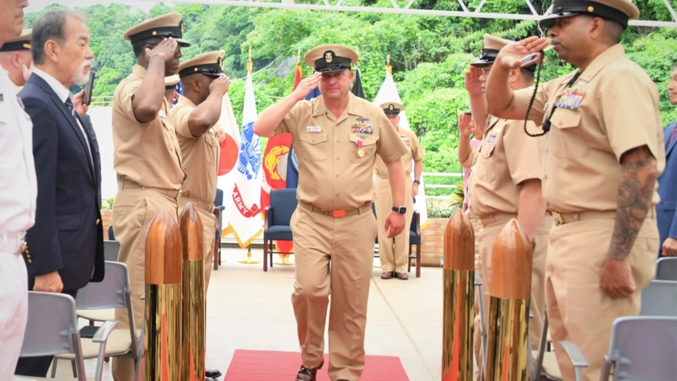 NAVSUP FLC Yokosuka (FLCY) Command Master Chief Todd Wende (middle) departs as the sideboys salute him for the final time due to medical retirement from the military.