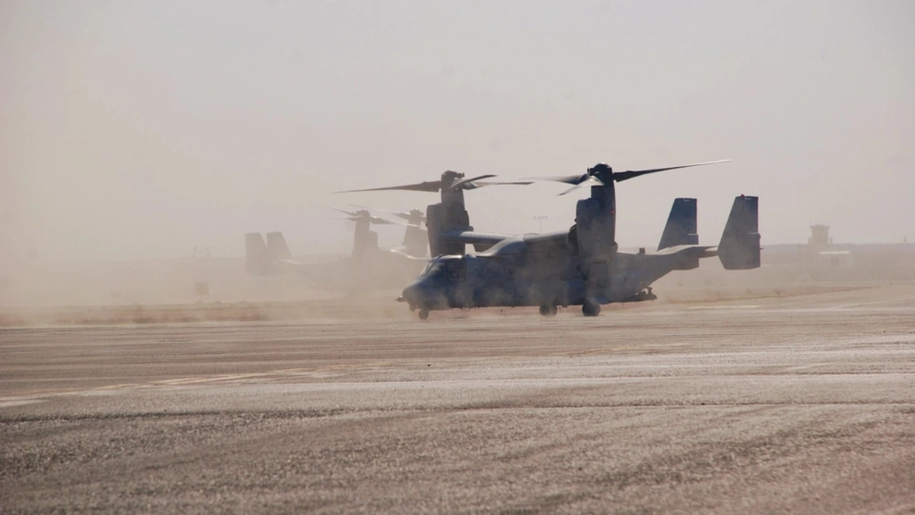 MV-22 Osprey plane, operated by aircrews with the United States Marine Corps, stop for refueling at an airfield in the 28th Expeditionary Combat Aviation Brigade's area of operations.