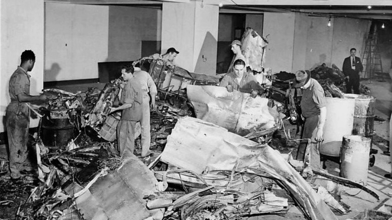 Photo of workmen clearing the wreckage of the Empire State Building plane crash at the 78th floor in 1945.