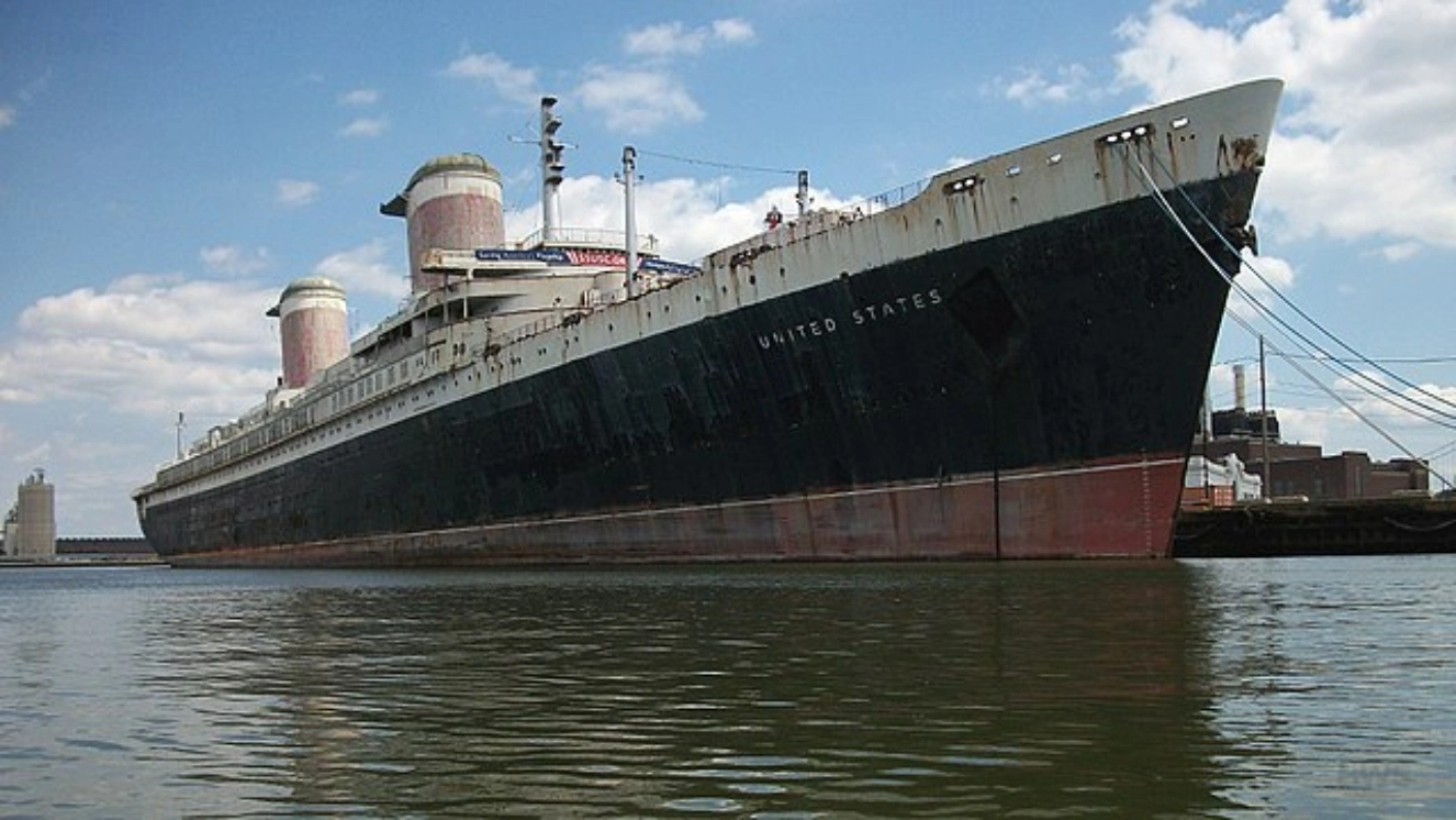 The side of the SS United States ship docking.