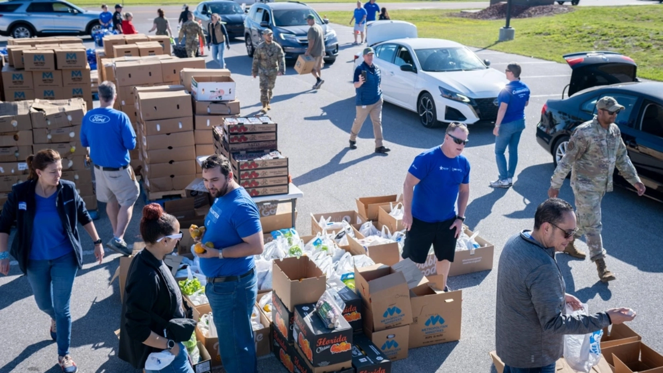 Volunteers at one of the best Veteran charities as they assist Blue Star Family volunteers during a Nourish the Service event at MacDill Air Force Base.