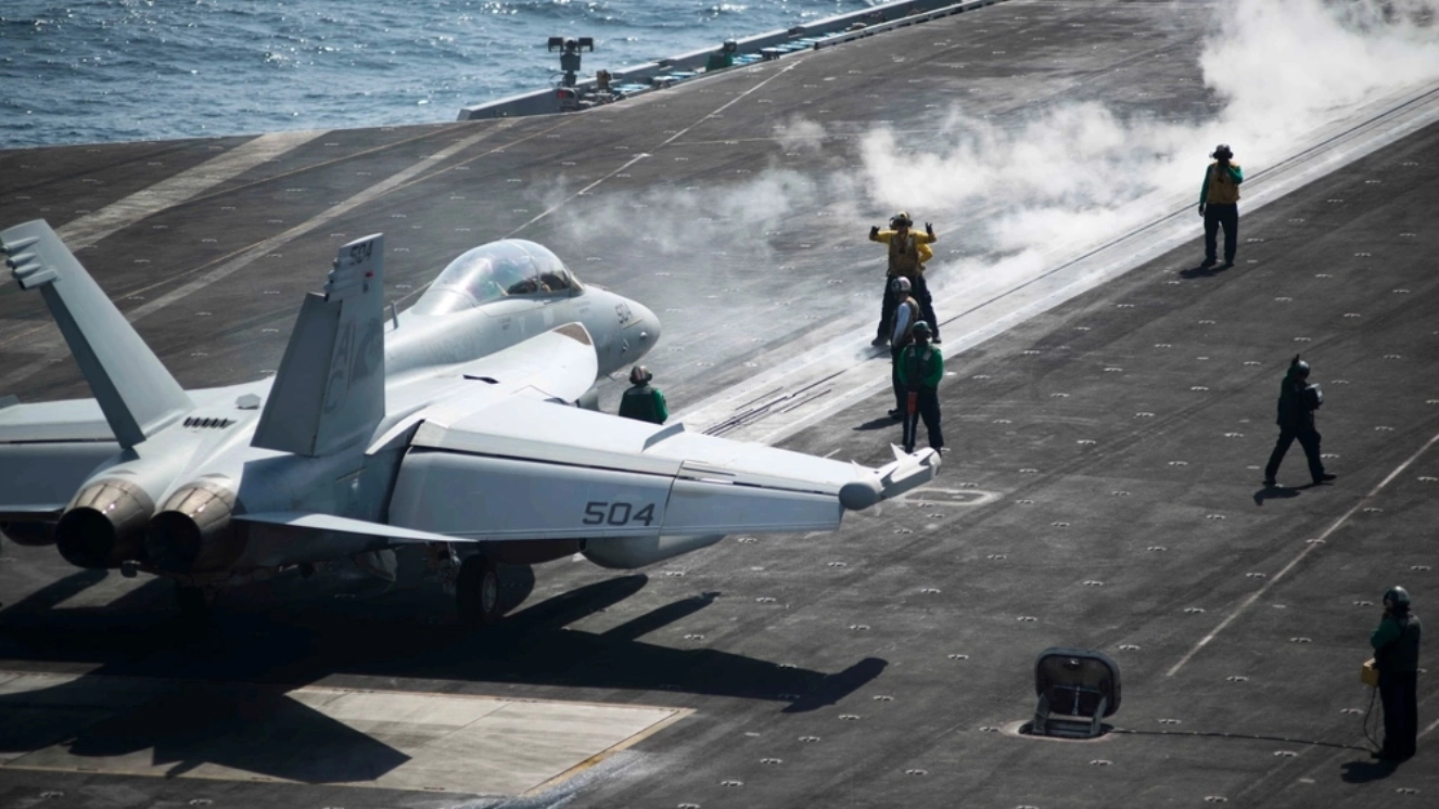 An EA 18G Growler crew assigned to the Zappers of Electronic Attack Squadron 130 prepares to launch from the flight deck of the aircraft carrier USS Harry S. Truman (CVN 75).