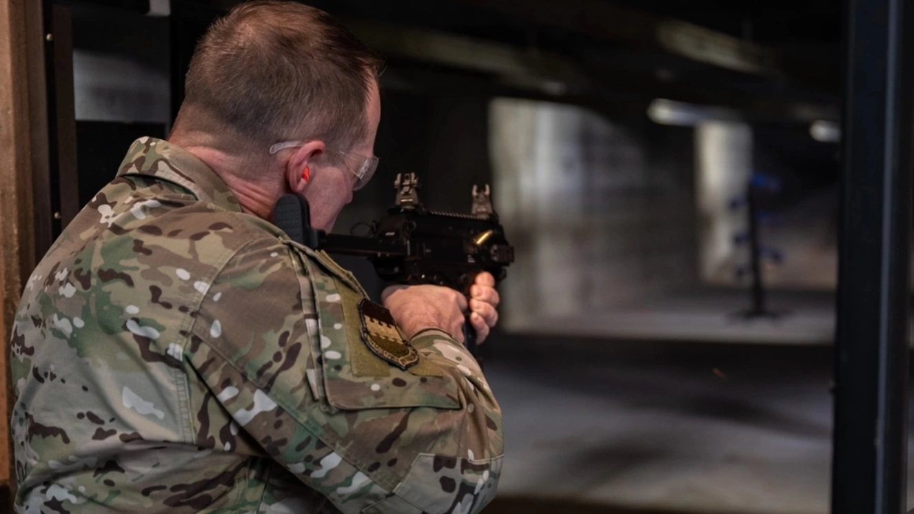 Solider shooting at a shooting range and using a free gun safe.