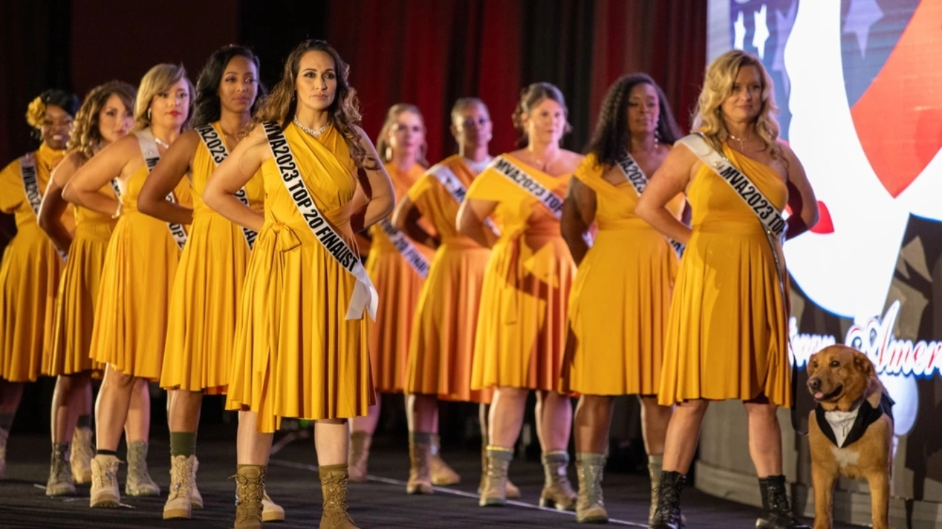 Participants stand on stage during Ms. Veteran America 2023 in Orlando, Fla., Oct. 8, 2023. Finalists from all branches of service competed for the opportunity to be the organization's ambassador for the following year.